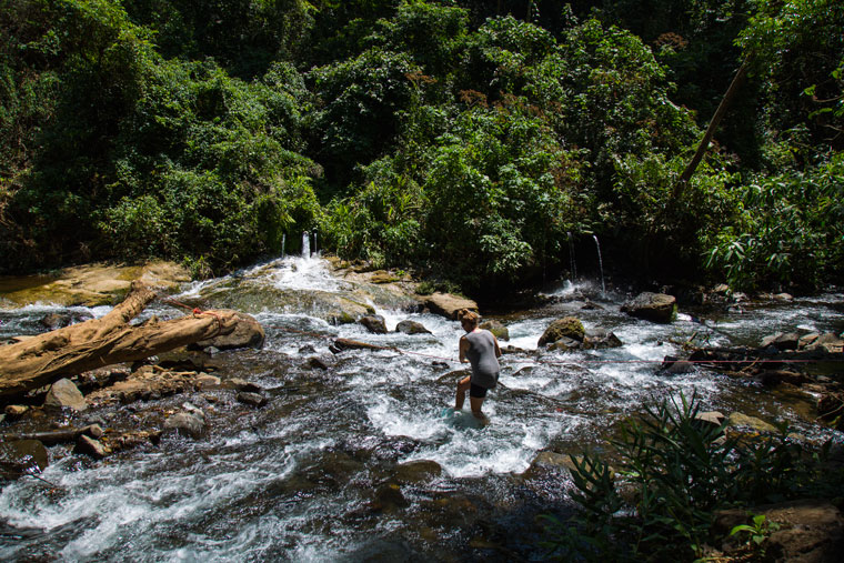 Walking across the river to the first Los Chorros waterfalls